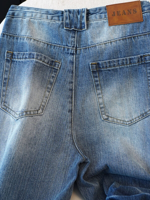 Washed Blue Curved Wide-Leg Denim Pants — Vintage Fade & Relaxed Knife-Leg Shape